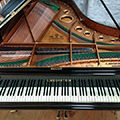 Bechstein Model B grand piano lid open with keyboard, desk, frame, soundbard, strings and case